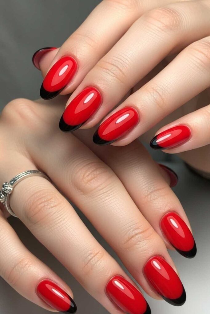 Classic Red Oval Nails with a Black Micro-French