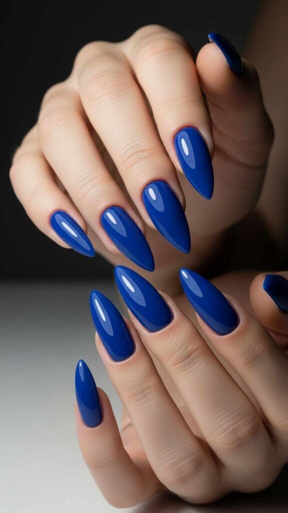 Cobalt Blue Stiletto Nails with a Glossy Wet Finish