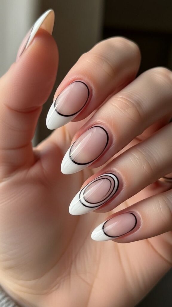 12 White French Tip Nails with Design Ideas That Look Effortlessly Expensive in 2026 2 Delicate Black Swirl on a Sheer White Tip