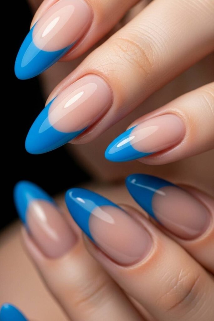 Electric Blue Tips on Glossy Nude Almond Nails