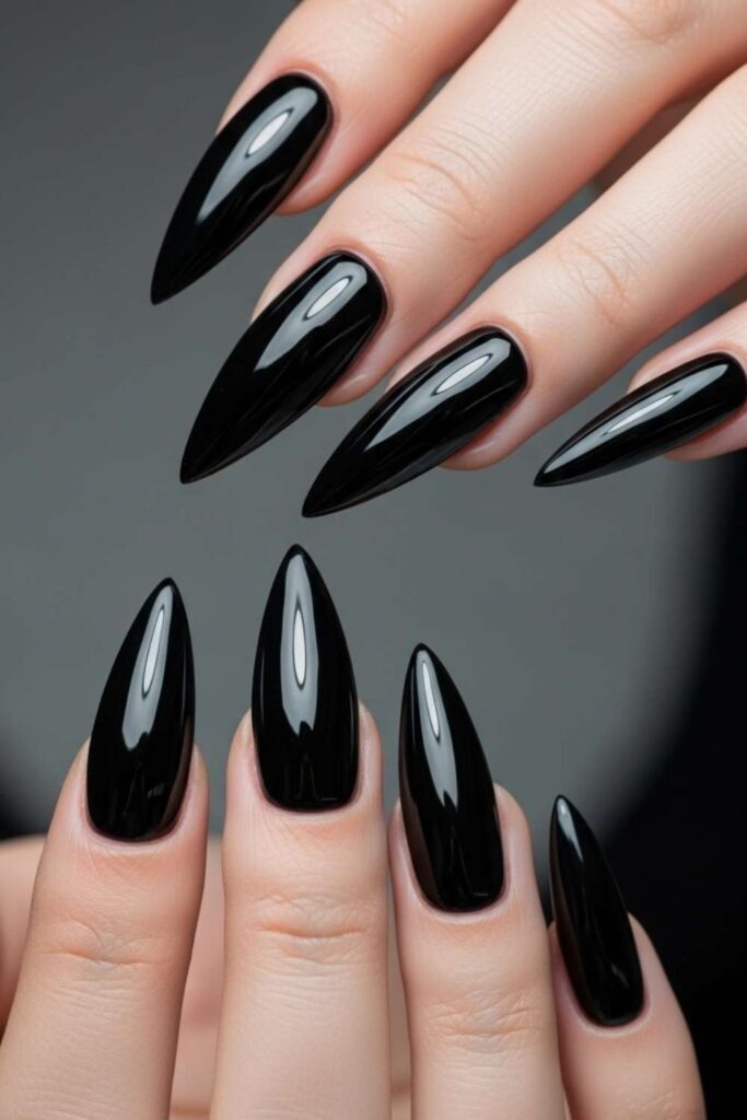41 Long Acrylic Nail Designs for Baddies That Hit Different in 2026 2 Jet Black Stiletto Nails with Liquid Chrome Tips