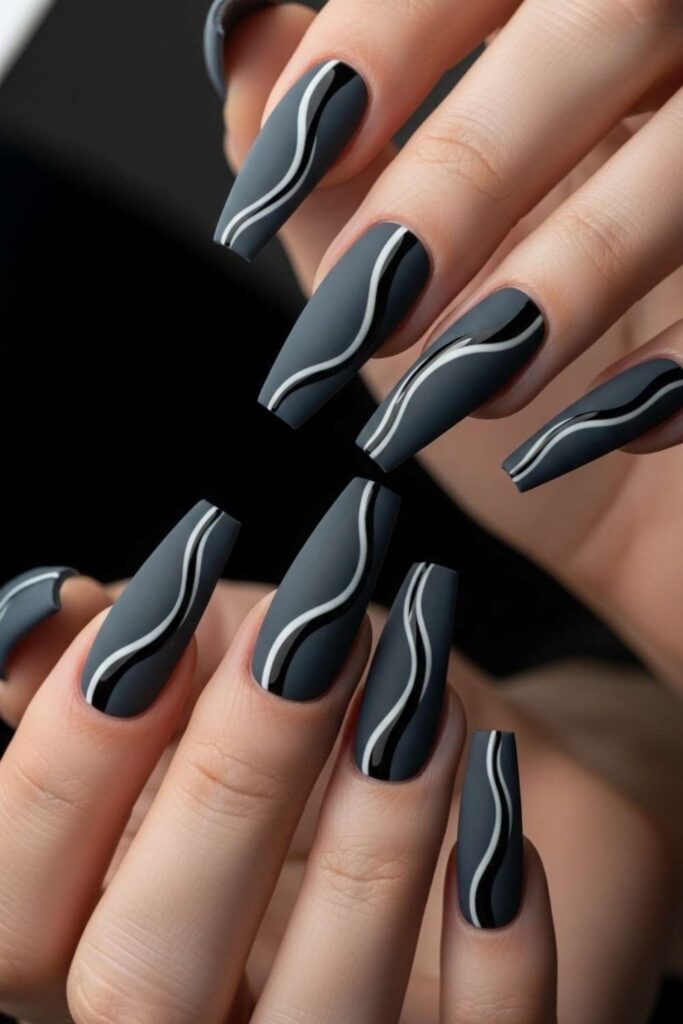 41 Long Acrylic Nail Designs for Baddies That Hit Different in 2026 11 Matte Charcoal Acrylics with Glossy Negative Space Lines