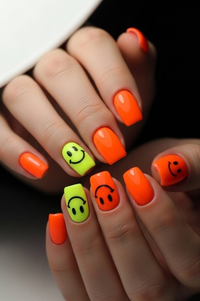 30 Nails That Bring 90s Art Back And Make It Look Better Than Ever 7 Neon Orange Base with Black Smiley Face Accents