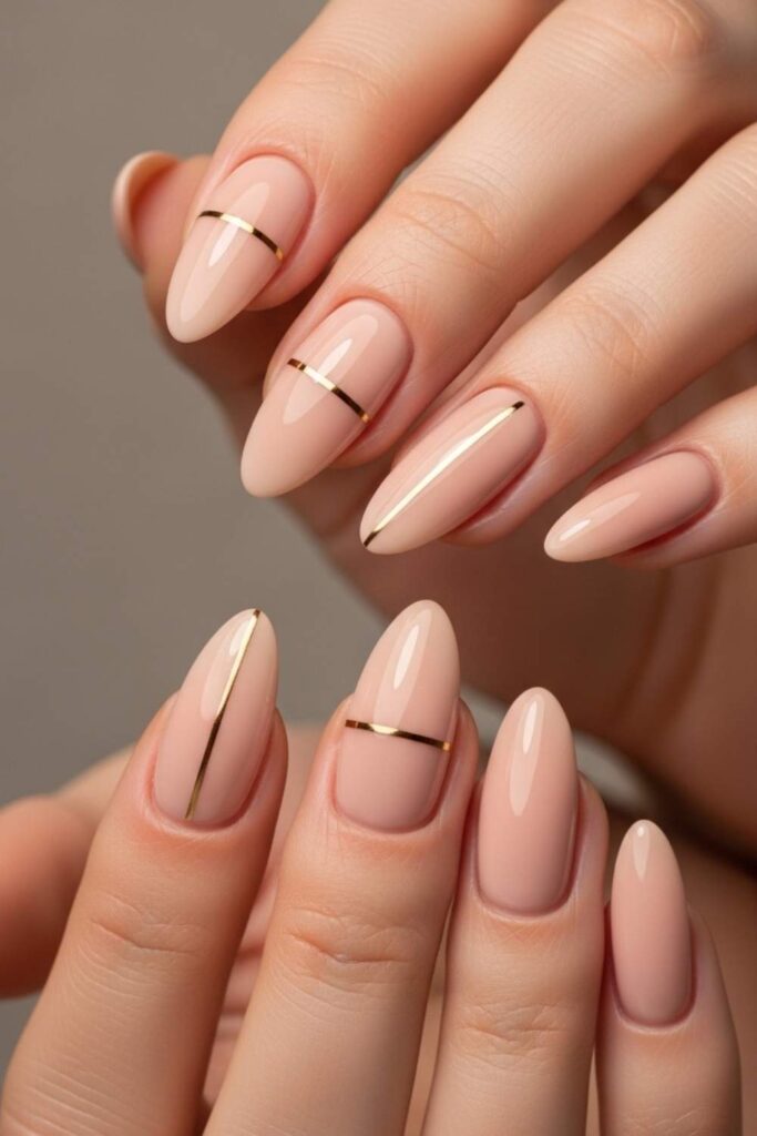 Nude Almond Nails with a Single Gold Line
