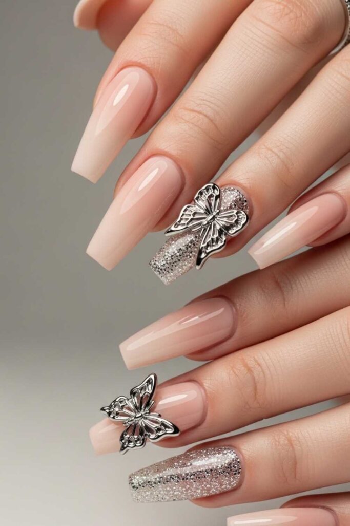 41 Long Acrylic Nail Designs for Baddies That Hit Different in 2026 4 Nude Coffin Nails with 3D Chrome Butterfly Accents