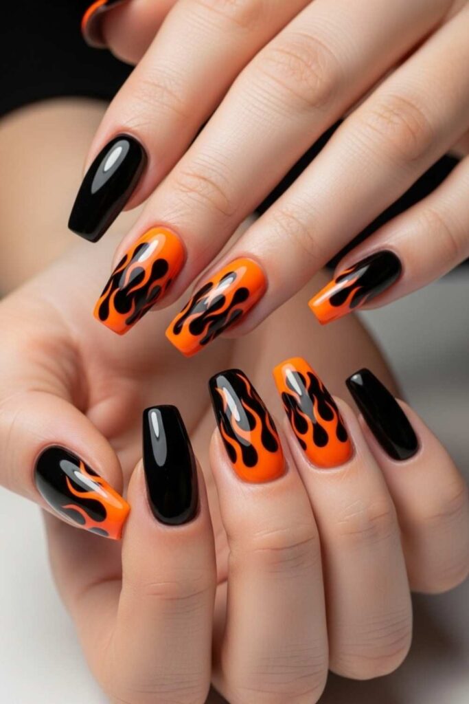 30 Nails That Bring 90s Art Back And Make It Look Better Than Ever 12 Orange Flame Tips with Black Base