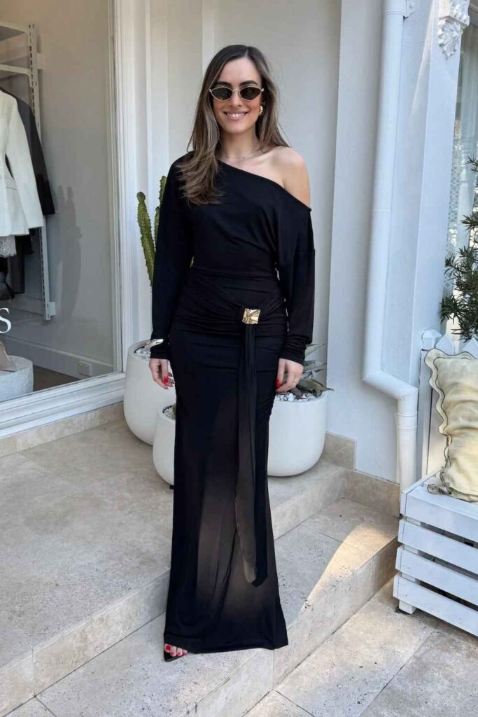 Black Bodycon Dress with a Bold Belt and Statement Earrings