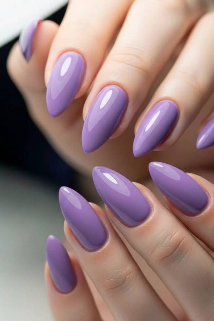 29 Summer Nail Ideas That Look Expensive Without Trying Too Hard 15 Blueberry Purple Oval Nails with a Glossy Finish