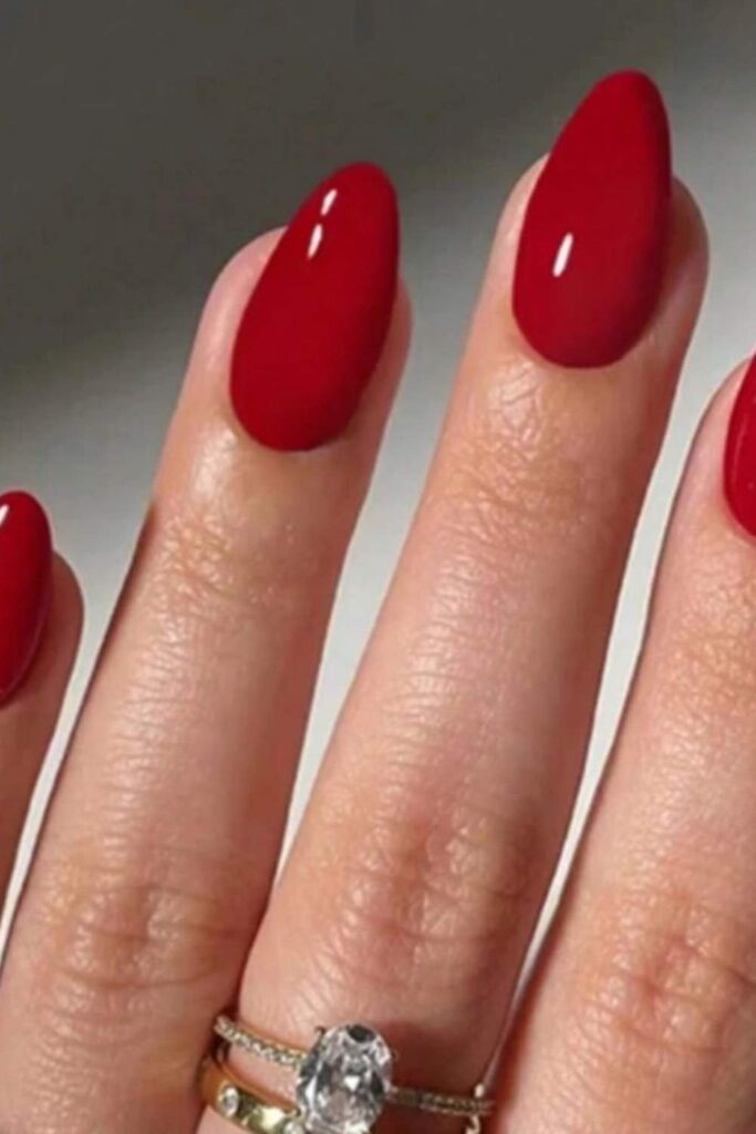 32 Red Acrylic Nail Designs That Always Look Like You Just Left the Salon 4 Classic Red Oval Acrylics in a High-Shine Gel Finish