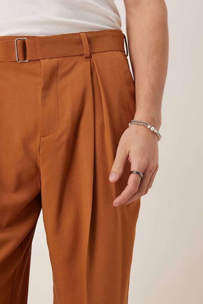 33 Stunning Office Outfits Women That Work From Desk to Dinner 8 Cream Pleated Wide-Leg Trousers with a Brown Leather Belt and Rust Blouse
