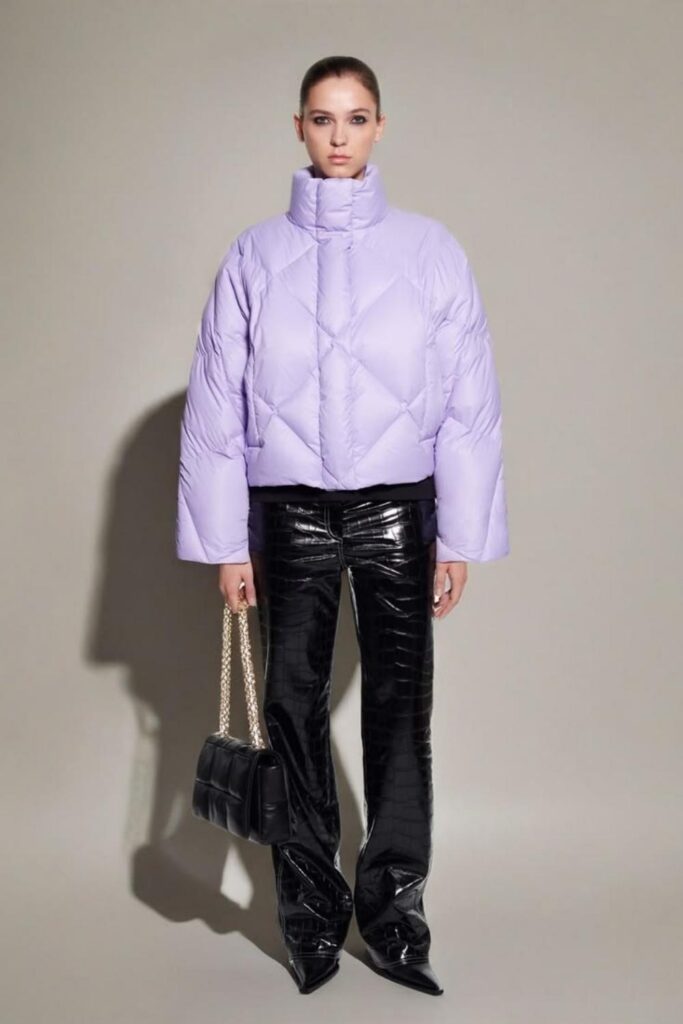 17 Street Style Outfits Casual Enough for Everyday But Cool Enough to Turn Heads 13 Cropped Puffer Jacket in Lavender with Straight Jeans and Clean Sneakers