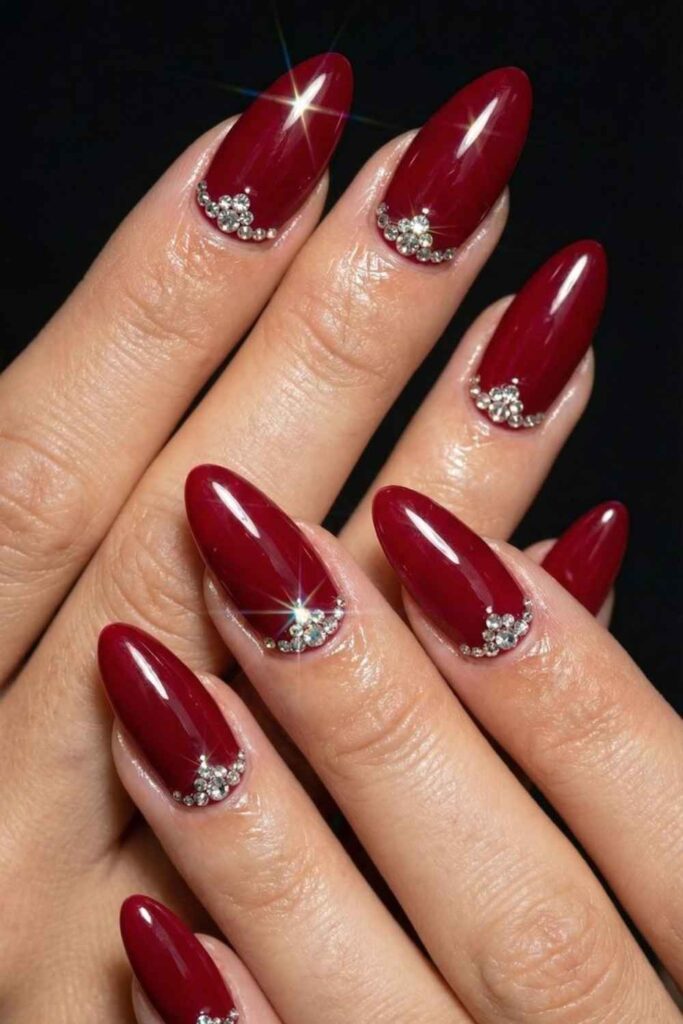 27 Red Acrylic Nails Designs That Look Expensive Without Trying Too Hard (2026) 8 Dark Red Acrylics with Scattered Diamond Rhinestones