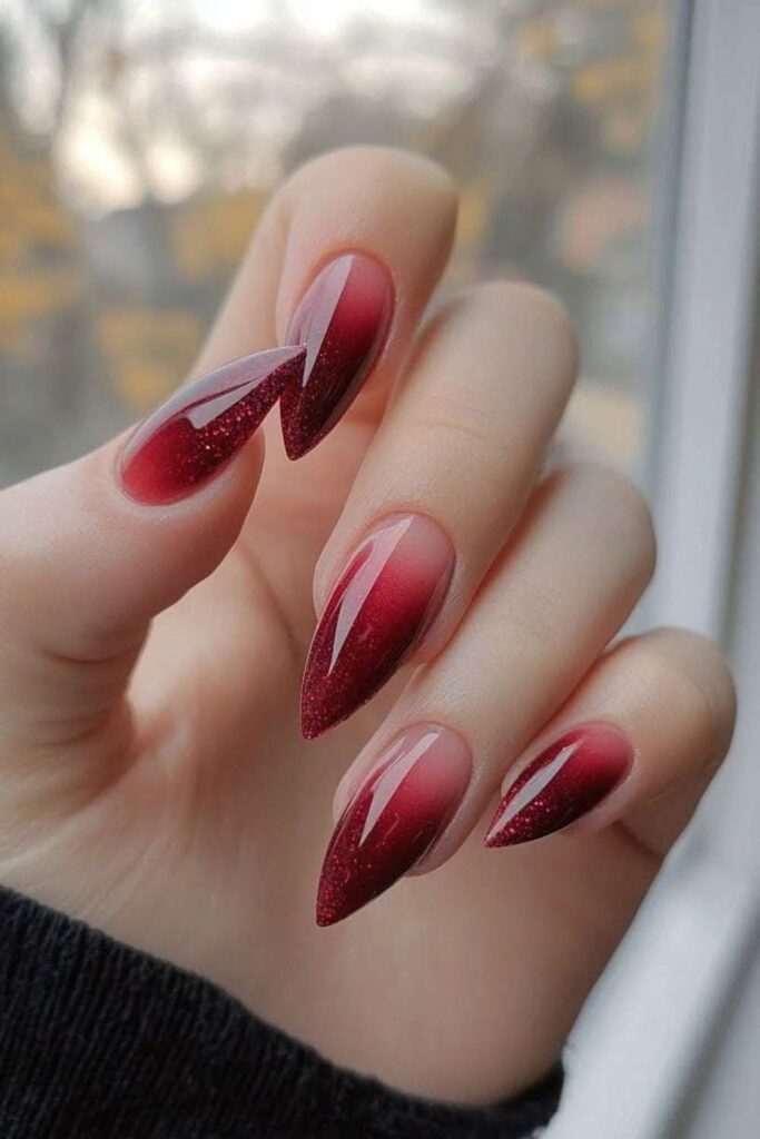 32 Red Acrylic Nail Designs That Always Look Like You Just Left the Salon 14 Dark Red Nails with Holographic Glitter Gradient
