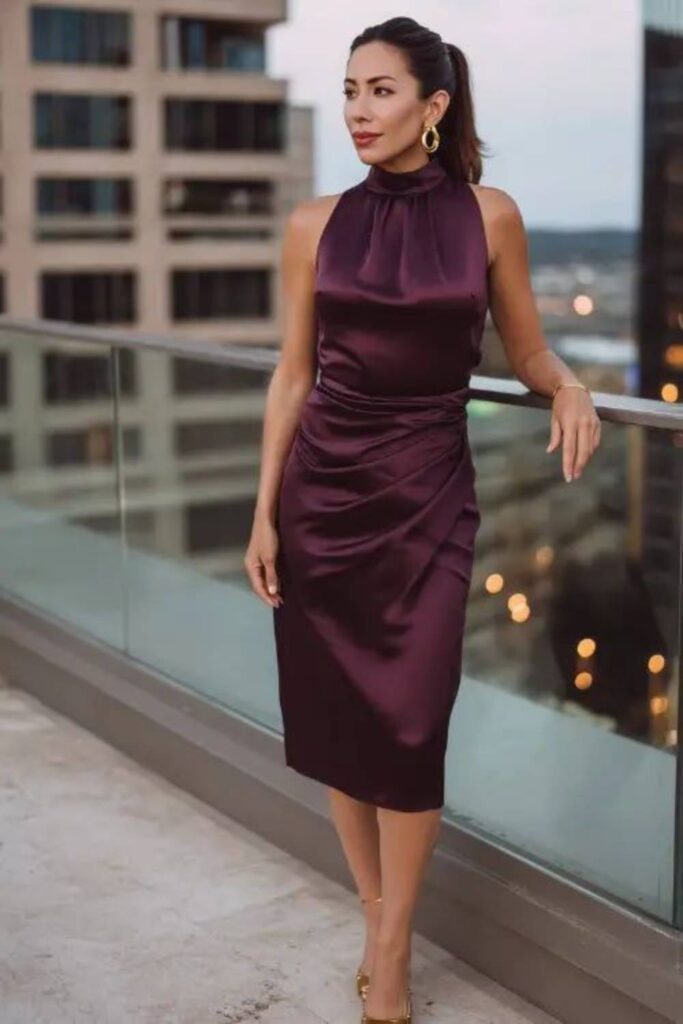 23 Date Night Outfits That Always Look Effortlessly Chic in 2026 3 Deep Plum Wrap Dress with Gold Statement Earrings