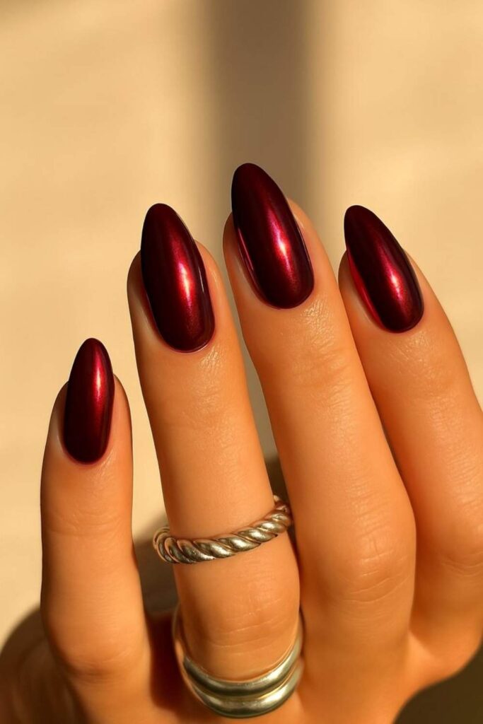 32 Red Acrylic Nail Designs That Always Look Like You Just Left the Salon 2 Glossy Cherry Red Almond Nails with a Mirror Finish