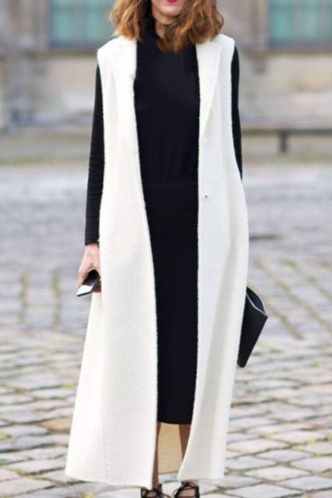83 Curvy Girl Outfits That Look Effortlessly Chic (2026 Edit) 14 Longline Vest Jacket Over a Maxi Dress