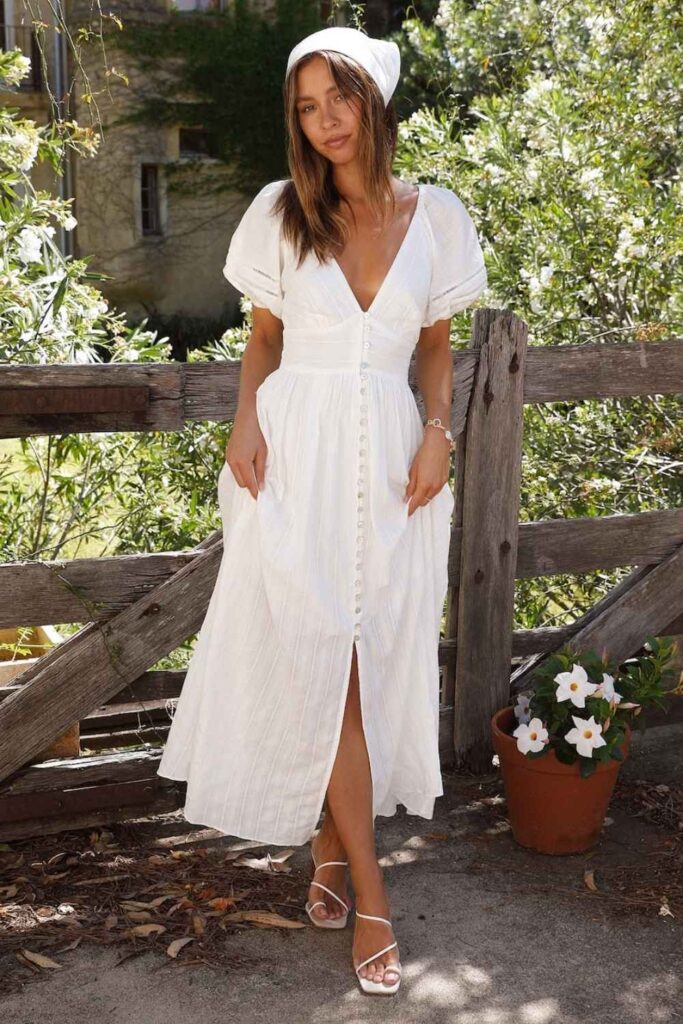 19 Best Birthday Outfit Ideas That Feel Like You, But Make-An-Entrance 8 Minimalist White Sundress with Gold Jewelry and Tan Accessories