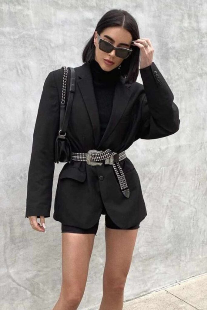 23 Date Night Outfits That Always Look Effortlessly Chic in 2026 9 Oversized Blazer with Cycling Shorts and Heeled Boots