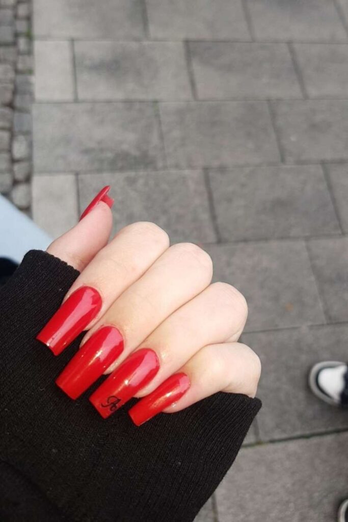 32 Red Acrylic Nail Designs That Always Look Like You Just Left the Salon 18 Red Acrylic Nails with Personalized Initial Charm