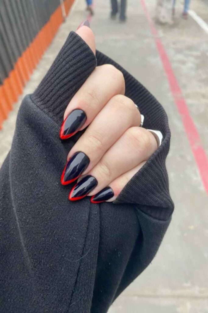 32 Red Acrylic Nail Designs That Always Look Like You Just Left the Salon 3 Red French Tip Acrylics with a Black Liner Detail