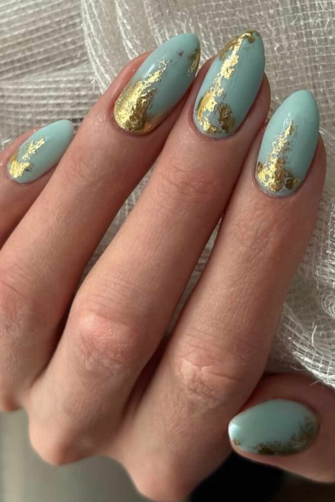 Soft Aqua Nails with Scattered Gold Flakes