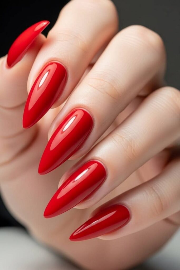 32 Red Acrylic Nail Designs That Always Look Like You Just Left the Salon 13 True Red Nails with a Glossy Pointed Stiletto Shape