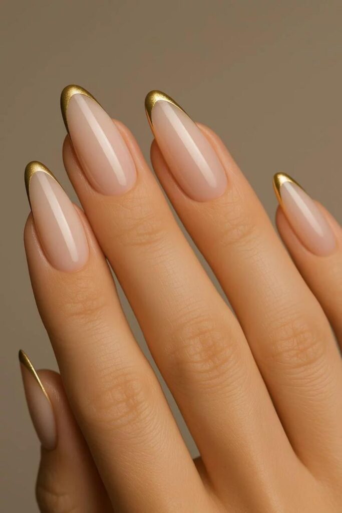 54 Cozy Fall Nails Aesthetic Ideas That Feel Like a Warm Latte in Your Hands 8 Warm Nude with Thin Gold French Tips